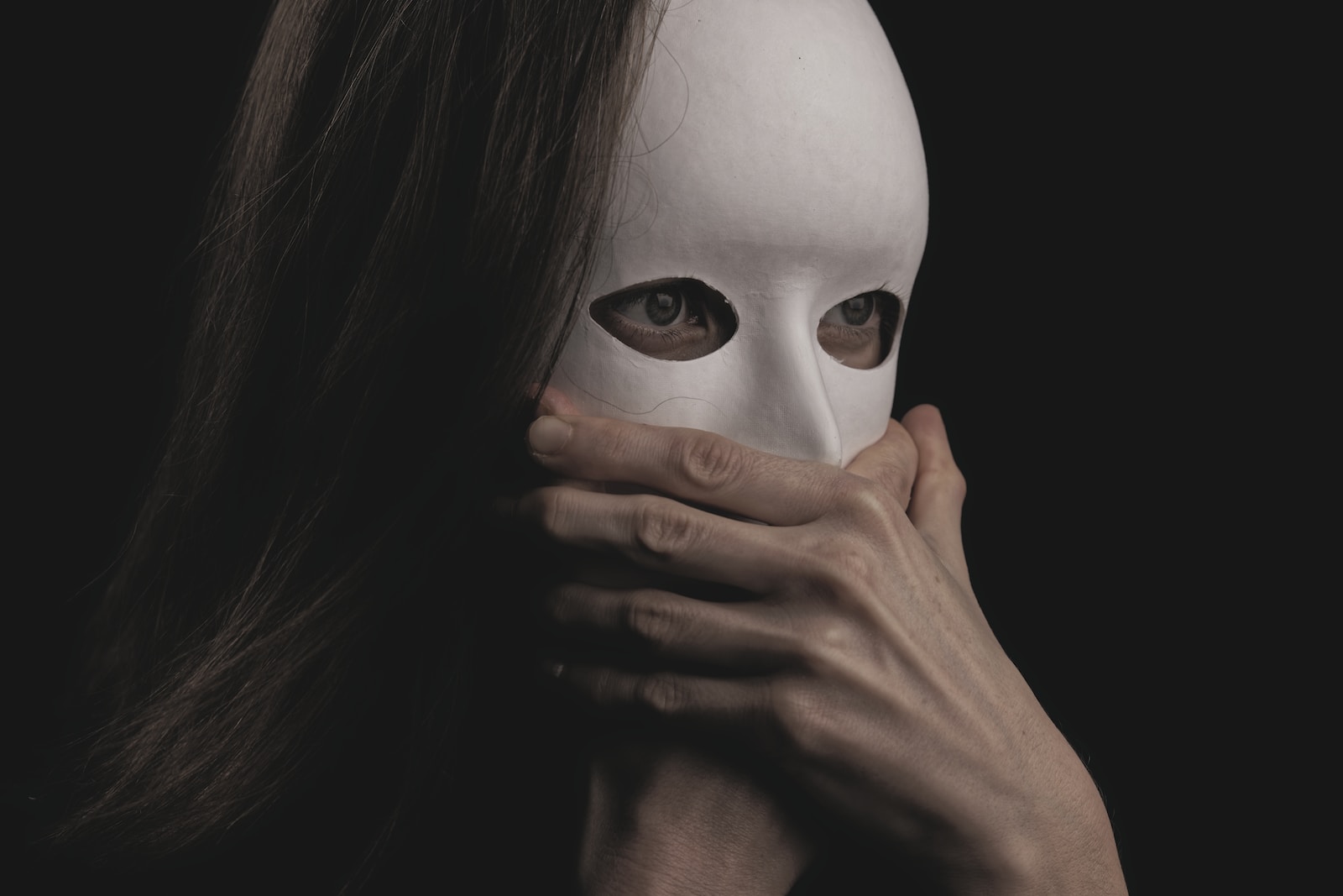 Photo by engin akyurt woman covering face with white mask
